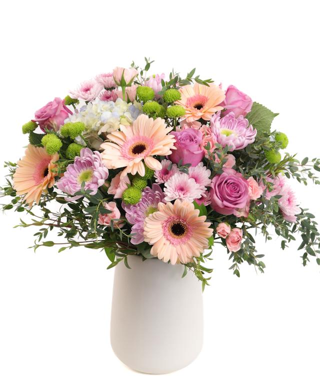 Garden Daydream from Allen’s Flowers, a pastel arrangement in a vase.